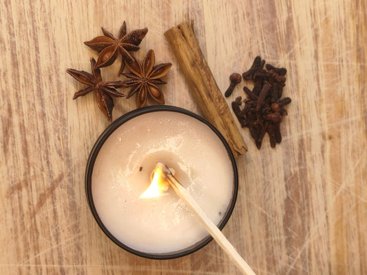 Candle being lit by a match